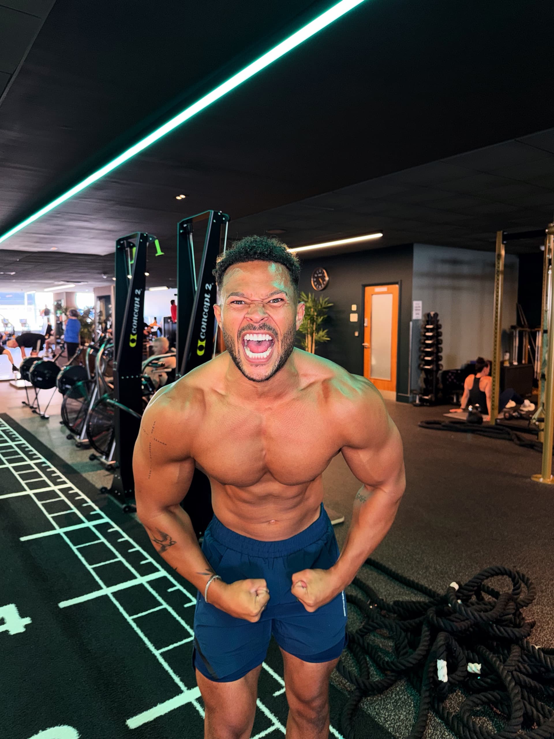 Cole Anderson James shouting through a front double biceps